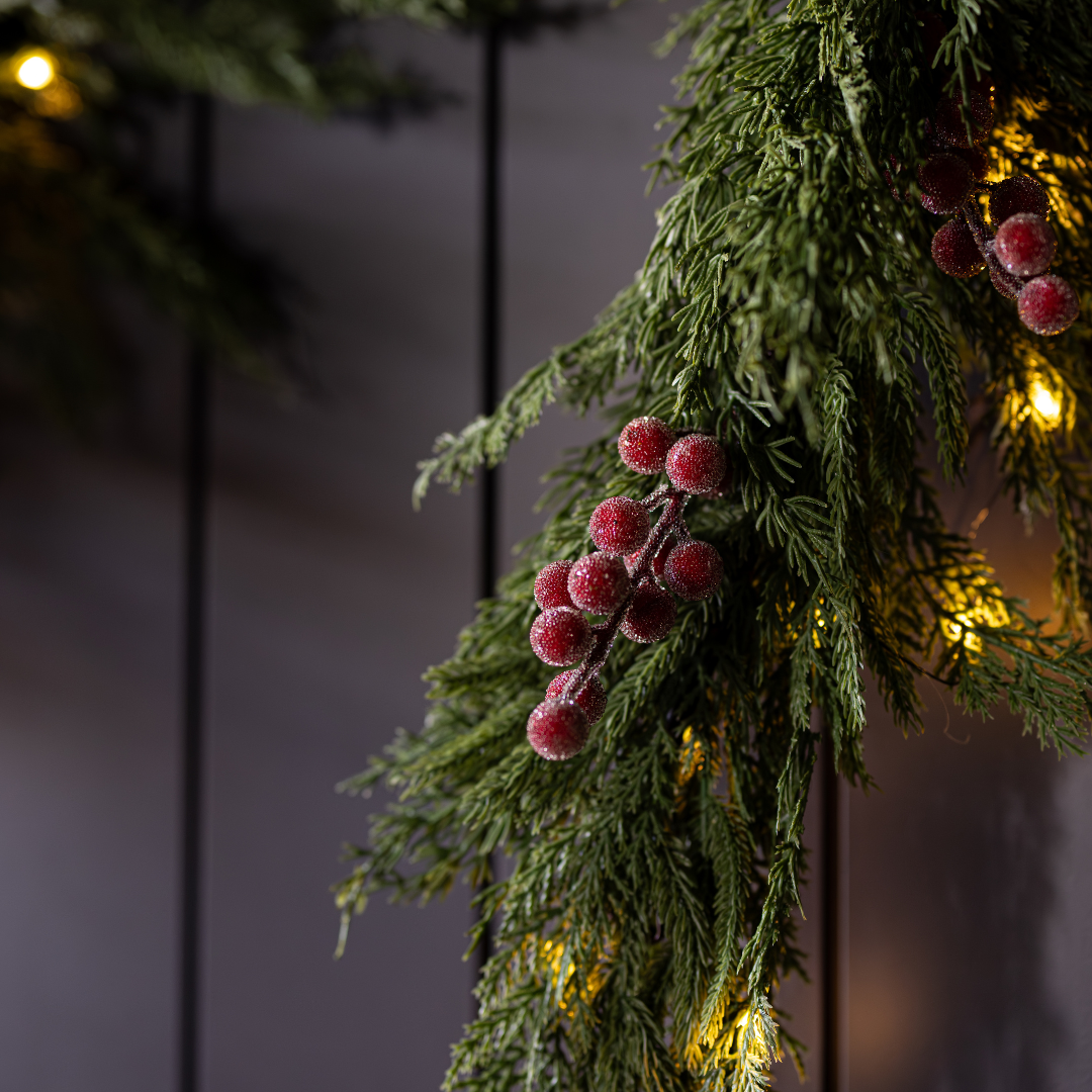 Red plum and frosted berry Norfolk Cypress Christmas garland, 15 ft, with realistic-looking greenery and berry accents.