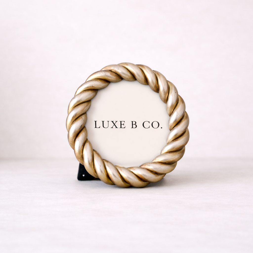 Round resin rope photo frame by Luxe B Co, featuring a circular design with textured rope detailing for decorative display.