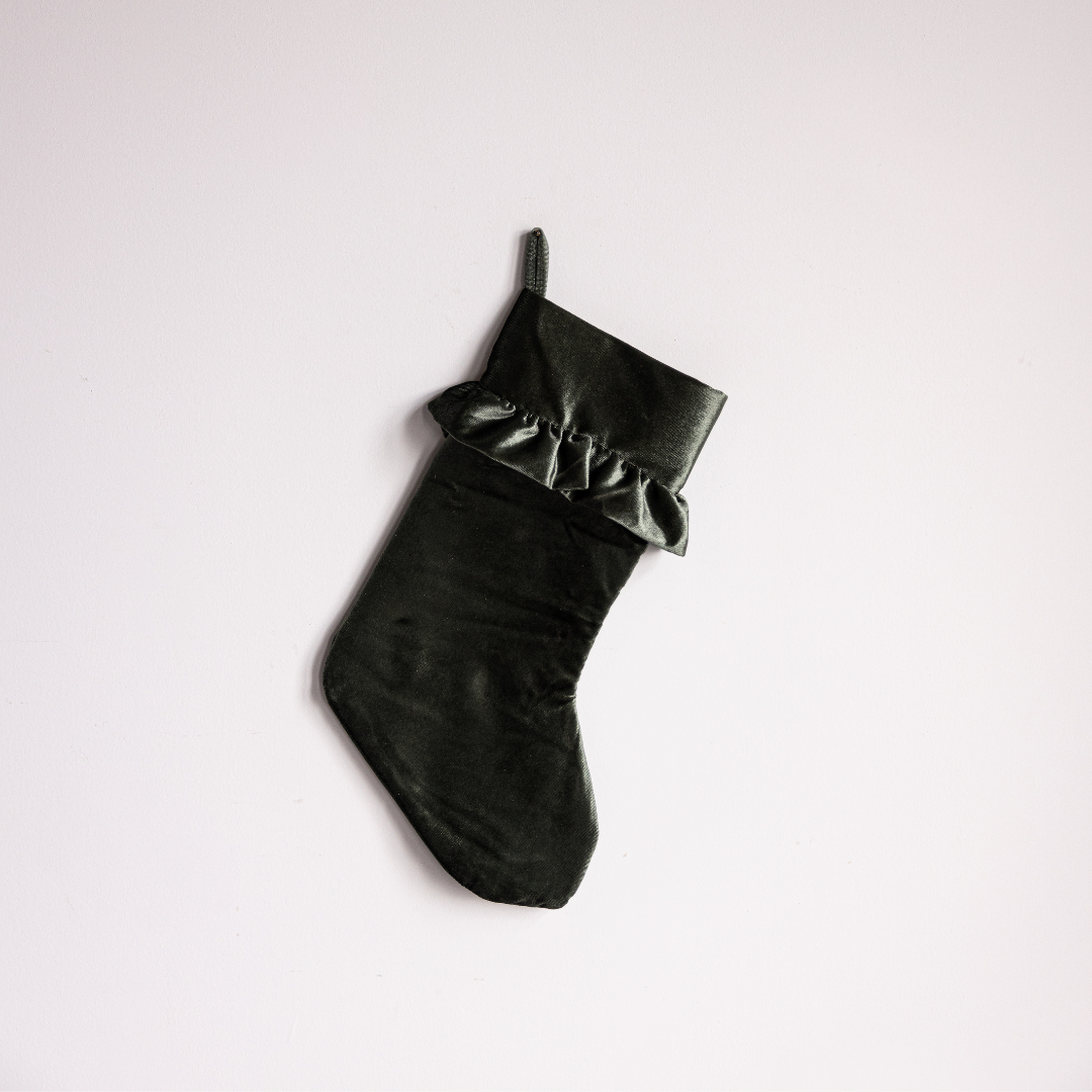 Sage velvet holiday stocking with plush texture and decorative cuff, by Luxe B Co. Perfect for festive home decor.