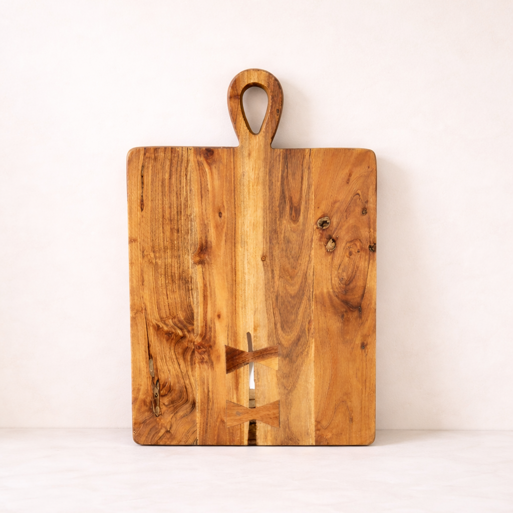 Wooden cutting board with handle on a white background