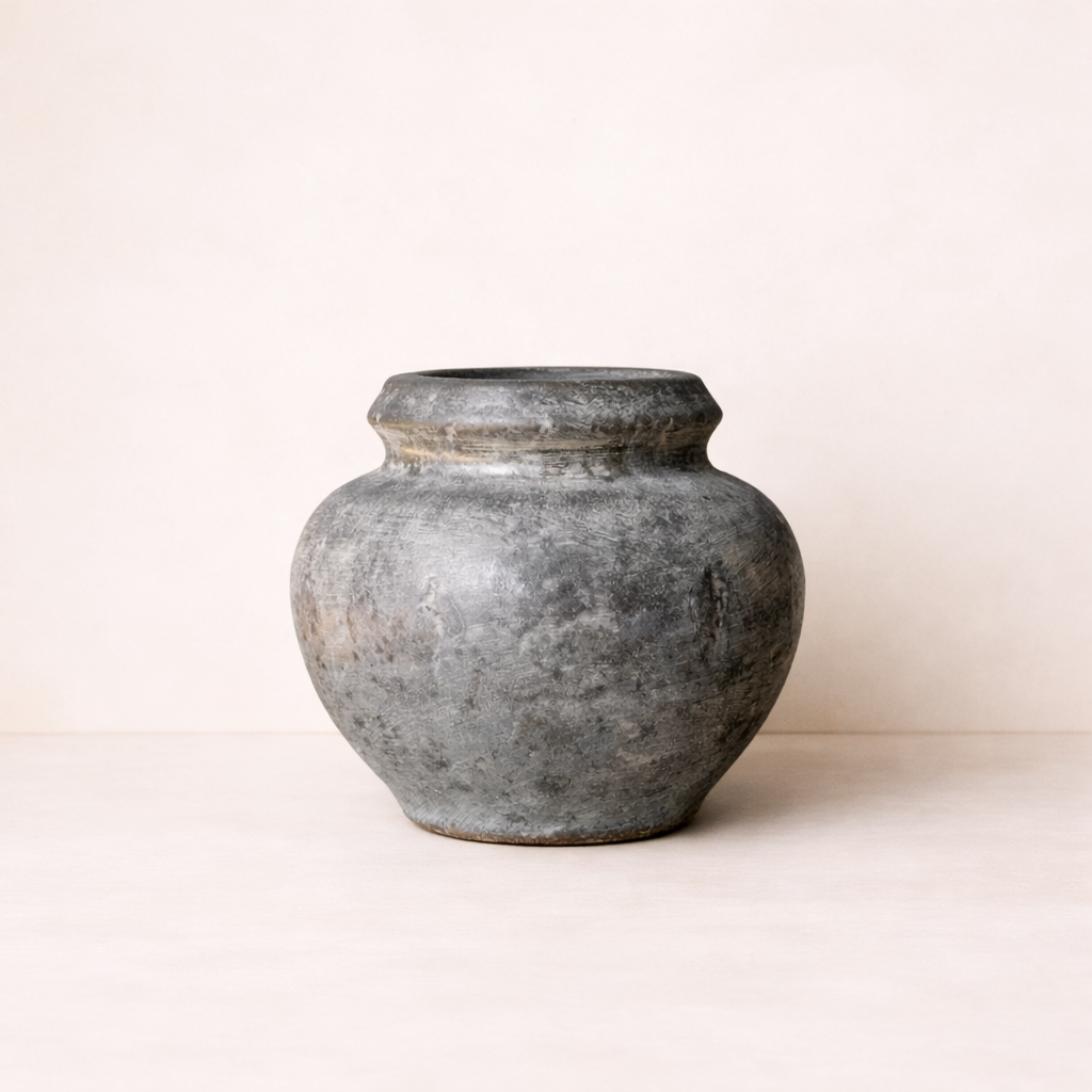 Vintage-style gray ceramic pot on a white background