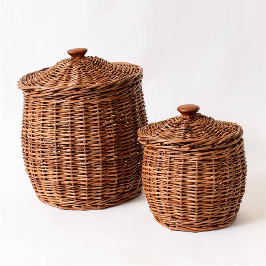 Set of wicker storage baskets with lids by Luxe B Co. featuring natural woven wicker, ideal for organizing home or closet spaces.