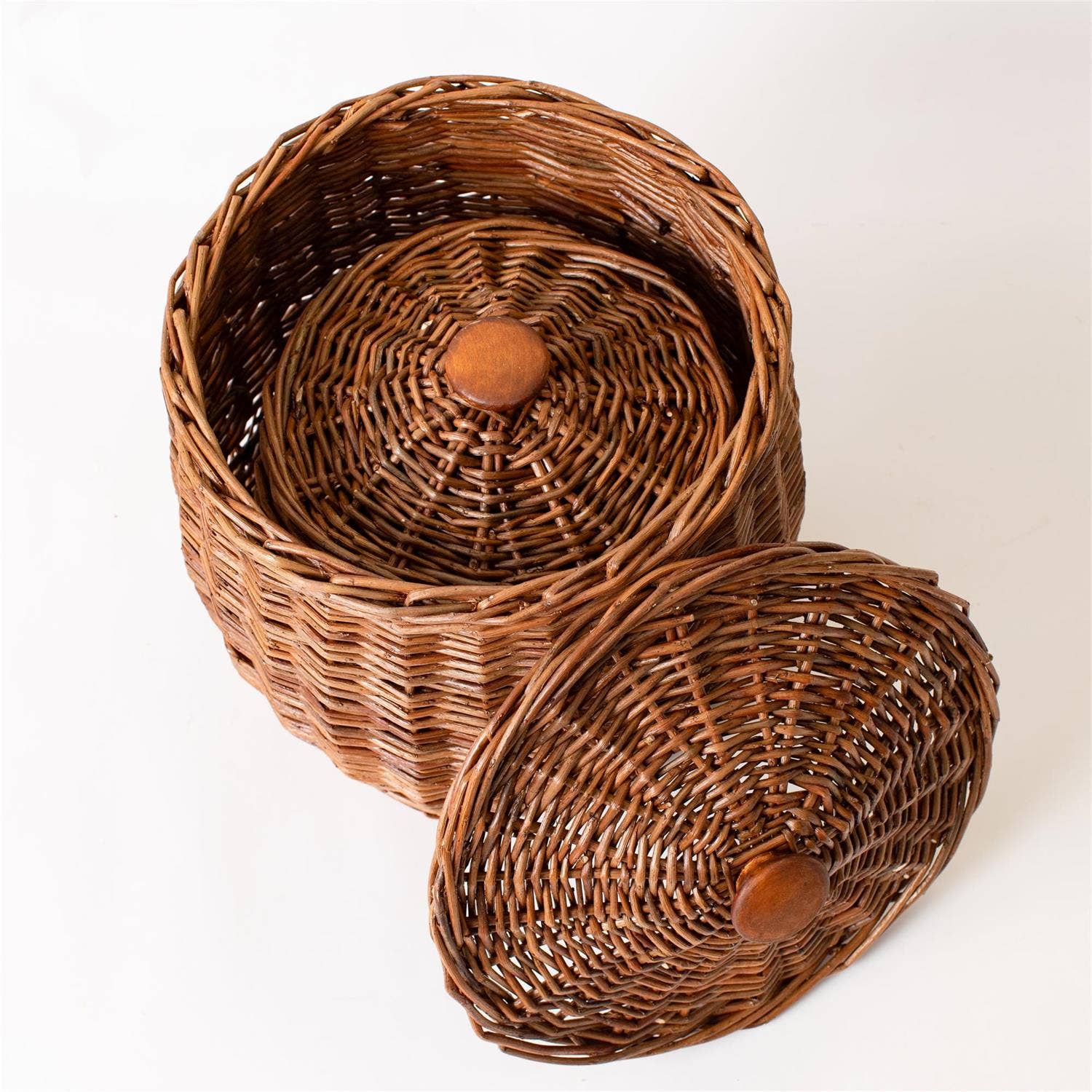 Set of three wicker storage baskets with lids from Luxe B Co., ideal for organizing and stylish home storage.