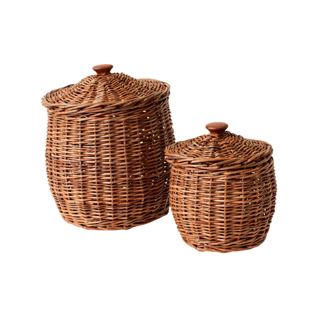 Set of four wicker storage baskets with lids by Luxe B Co., featuring natural woven wicker design and functional lids for organization.
