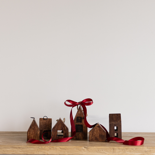 Wooden holiday village houses decorative set by Luxe B Co, featuring charming miniature Christmas scene for festive decor.
