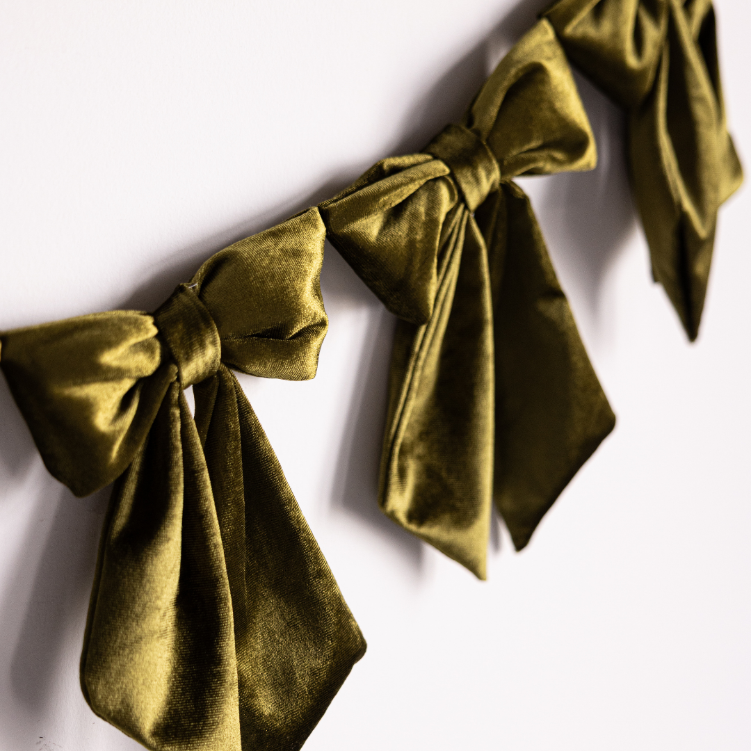 Mini holiday velvet bow garland with chartreuse velvet fabric bows, perfect for holiday decor from Luxe B Co.